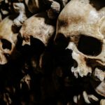 Skull Caves - stack human bones photo
