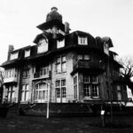 Haunted Hotel - a black and white photo of a large building