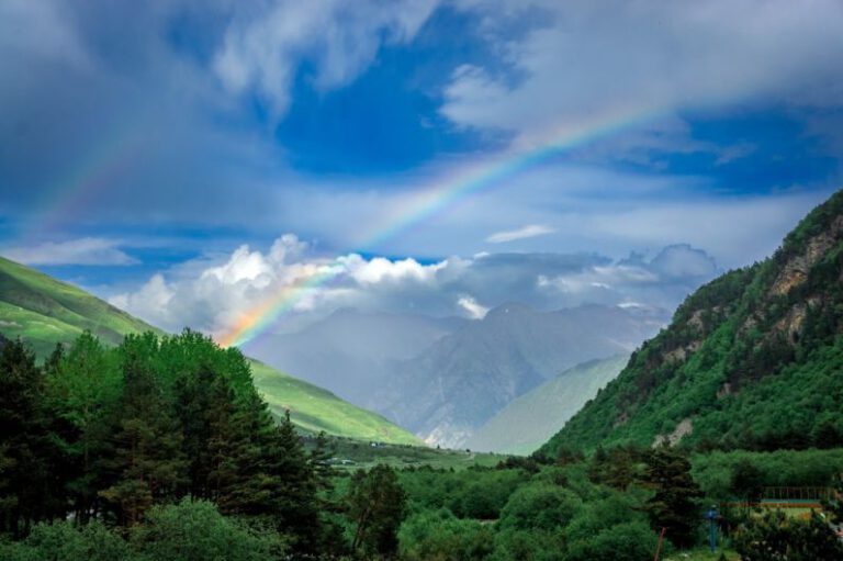 Rainbow Hills - a rainbow in the sky over a valley