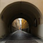 Narrow Streets - a street with a tunnel between two buildings